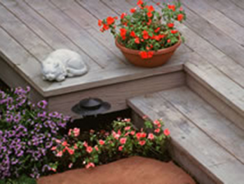 Redwood decking weathered to a silver gray color.